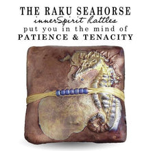 Load image into Gallery viewer, Seahorses are not good swimmers and can die of exhaustion. To prevent being washed away they anchor themselves to coral or sea grass with their tails. The Seahorse innerSpirit Rattle is a symbol of determination.